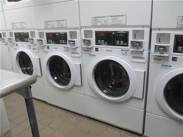 washroom with tile patterned flooring, washing machine and dryer, and stacked washing maching and dryer