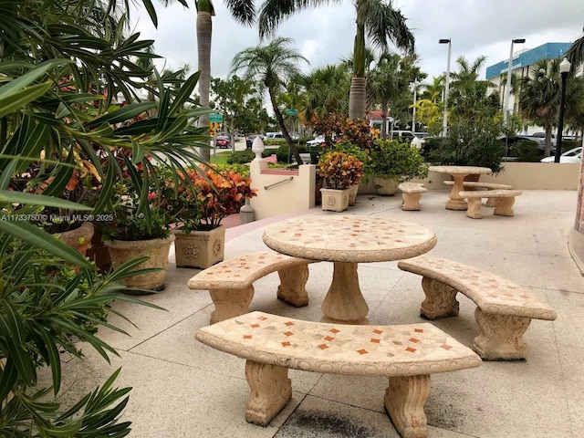 view of property's community with a patio area