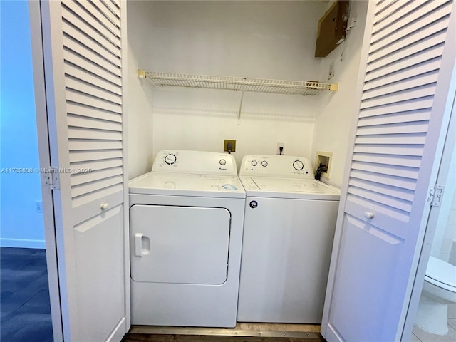 washroom with washing machine and dryer