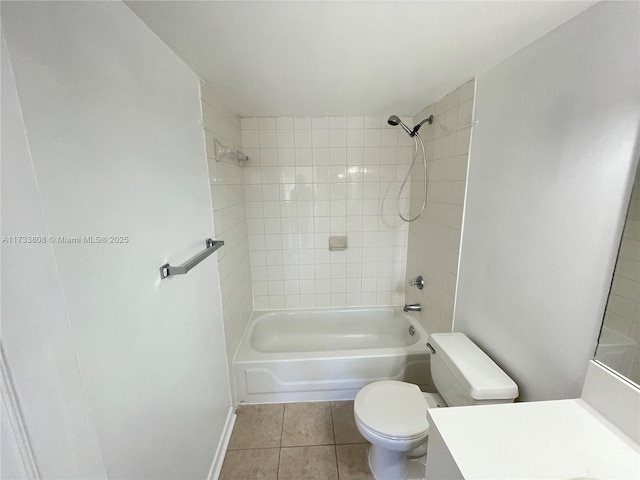 full bathroom featuring tiled shower / bath, vanity, toilet, and tile patterned flooring