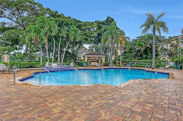 view of swimming pool with a patio