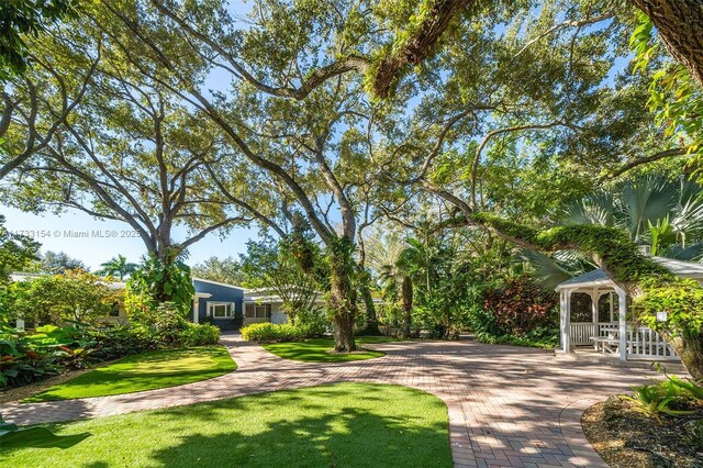 view of home's community with a gazebo and a lawn