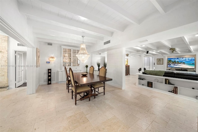 dining space featuring ceiling fan and beam ceiling