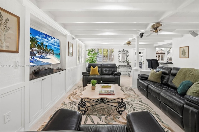 living room with ceiling fan and beam ceiling