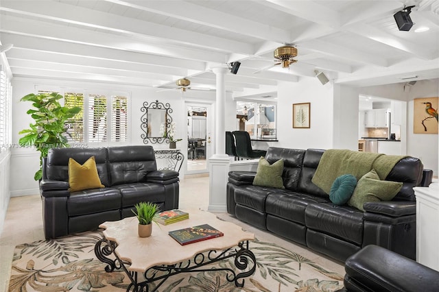 living room featuring beamed ceiling, ceiling fan, decorative columns, and light carpet