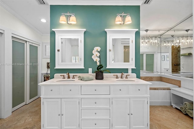 bathroom with vanity, a bath, tile patterned flooring, and ornamental molding