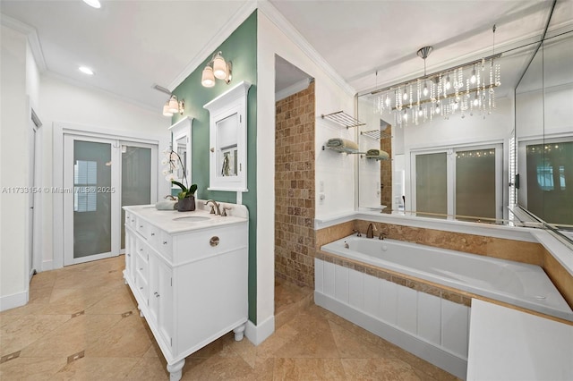 bathroom featuring crown molding, tiled bath, tile patterned floors, and vanity