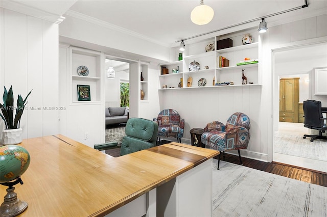 office area with ornamental molding, dark hardwood / wood-style flooring, built in features, and rail lighting