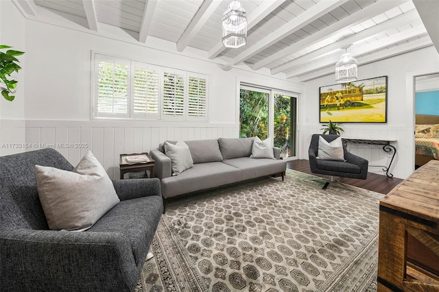 living room featuring hardwood / wood-style flooring and lofted ceiling with beams