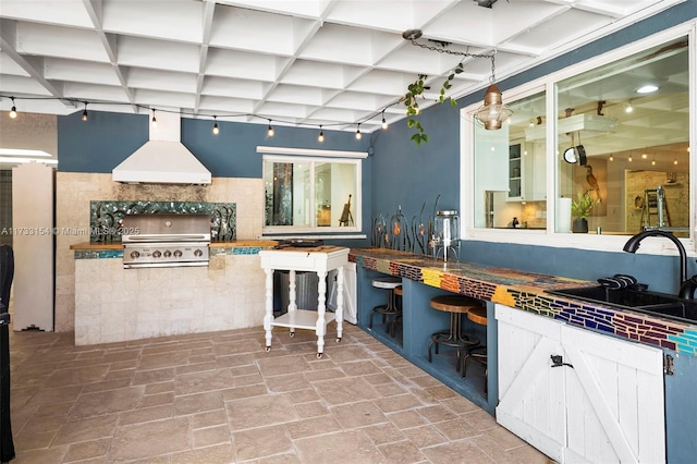 view of patio featuring area for grilling, sink, and exterior kitchen