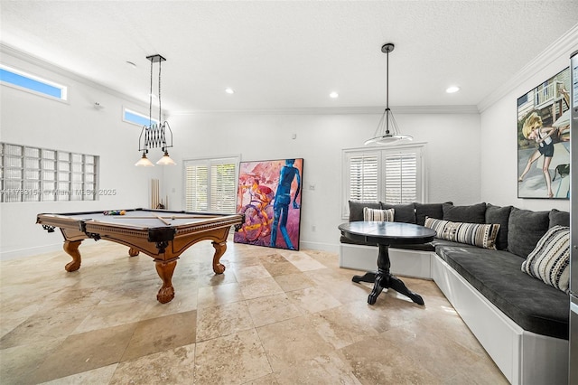 game room with pool table, a wealth of natural light, ornamental molding, and a textured ceiling