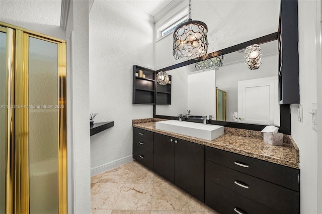 bathroom with vanity, ornamental molding, and walk in shower