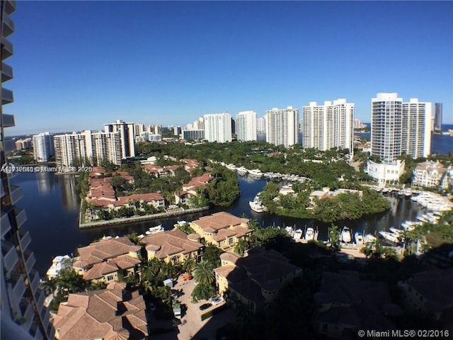 drone / aerial view with a water view and a city view