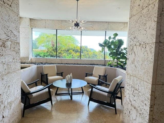 sunroom with a notable chandelier