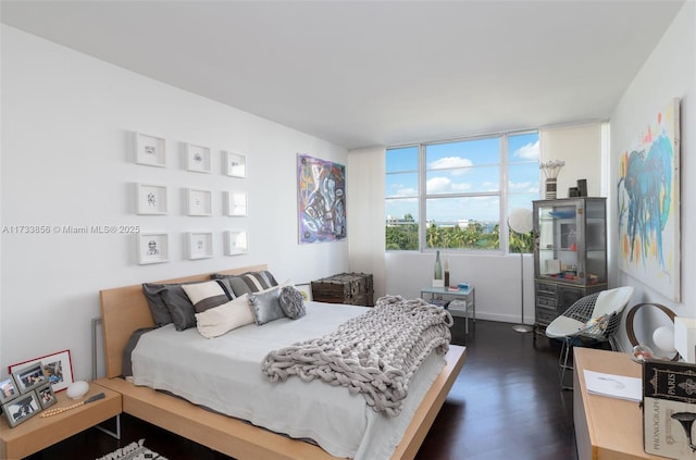 bedroom featuring dark hardwood / wood-style floors