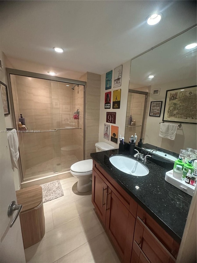 bathroom with vanity, an enclosed shower, tile patterned floors, and toilet