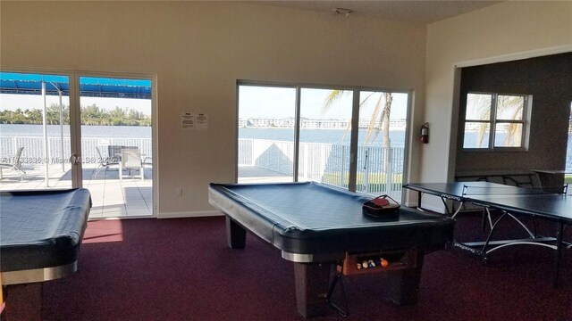 playroom featuring billiards and a water view