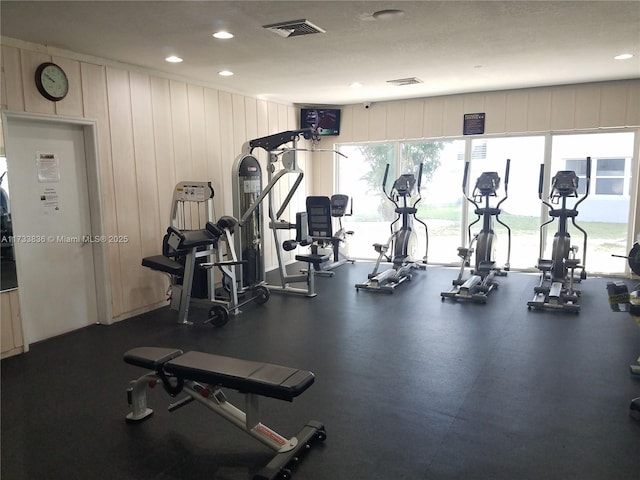 workout area featuring recessed lighting and visible vents