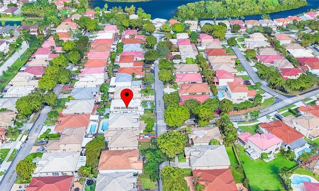 aerial view with a water view and a residential view