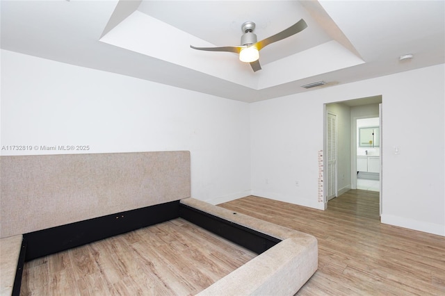 8196 SW 163rd Ct, Miami, FL 33193 - unfurnished room with a tray ceiling, wood finished floors, a smoke detector, and a ceiling fan