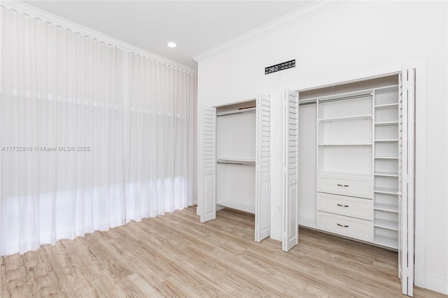 8196 SW 163rd Ct, Miami, FL 33193 - unfurnished bedroom with light wood-style flooring, two closets, ornamental molding, and recessed lighting
