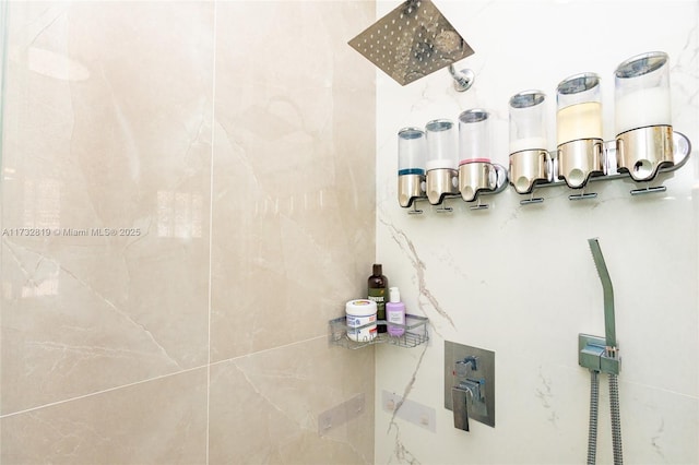 bathroom with tiled shower