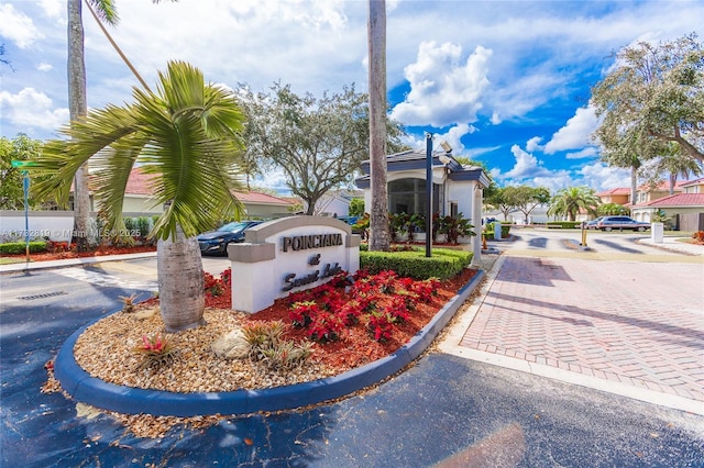 8196 SW 163rd Ct, Miami, FL 33193 - view of asphalt street with curbs and a gated entry