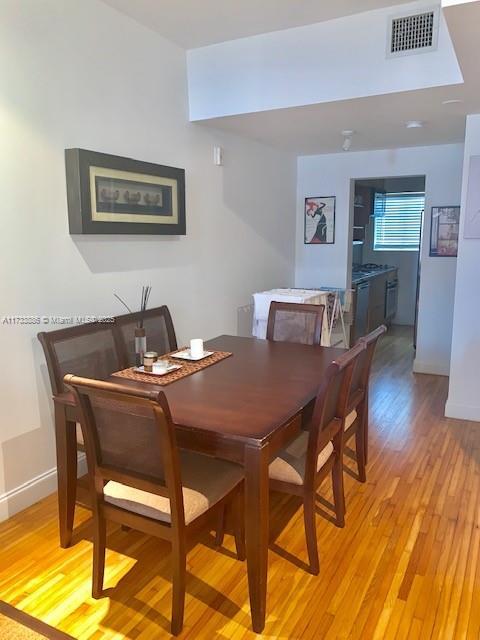 dining area with light hardwood / wood-style floors