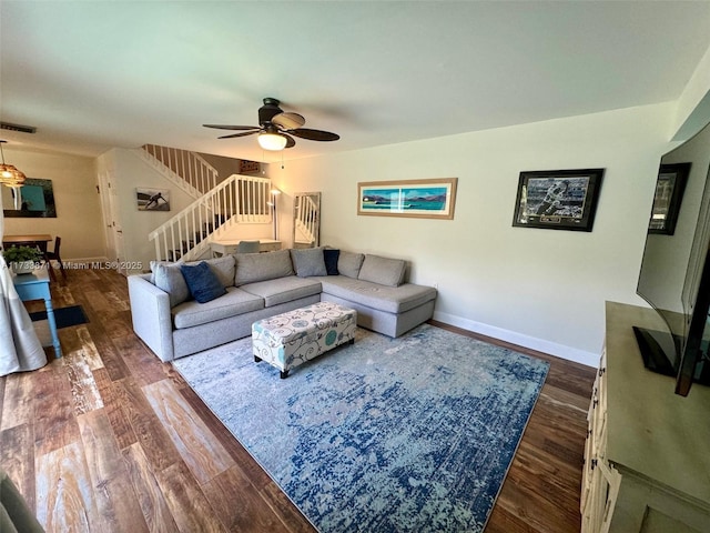 living room with dark hardwood / wood-style floors and ceiling fan