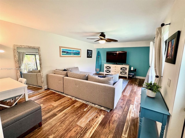 living room with hardwood / wood-style flooring and ceiling fan