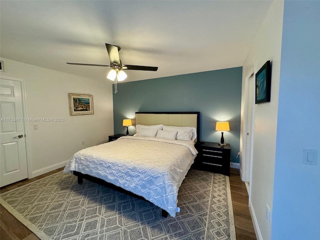 bedroom with hardwood / wood-style floors and ceiling fan