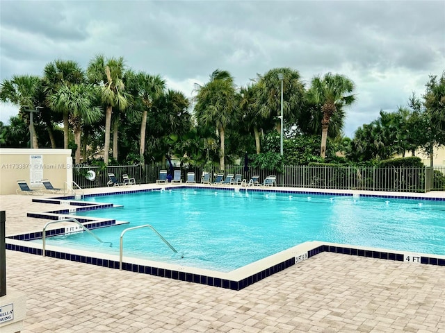 view of swimming pool with a patio