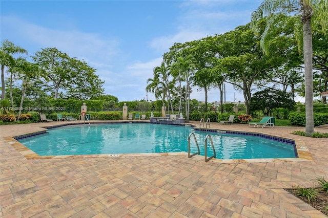 view of pool featuring a patio area