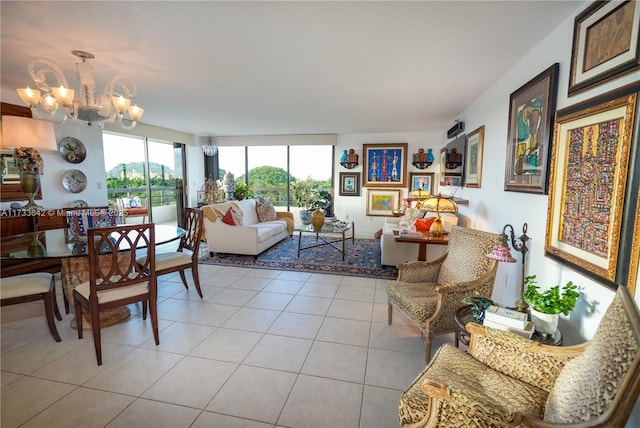 living room with a notable chandelier and light tile patterned floors