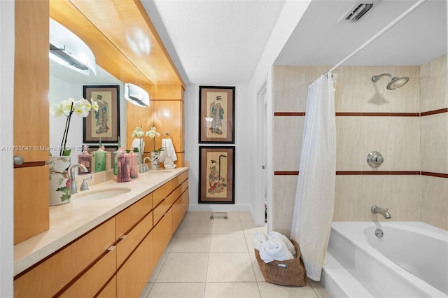 bathroom with shower / tub combo with curtain, tile patterned floors, and vanity