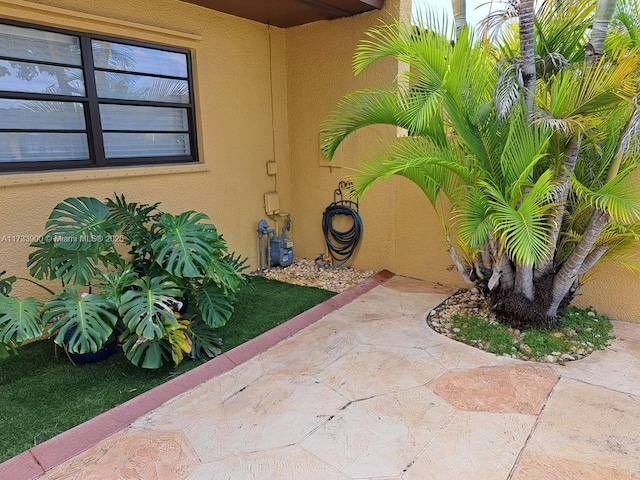 entrance to property featuring a patio