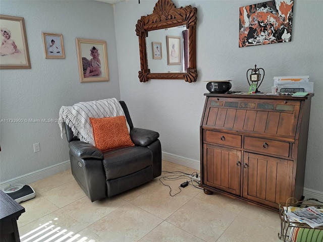 sitting room featuring light tile patterned flooring