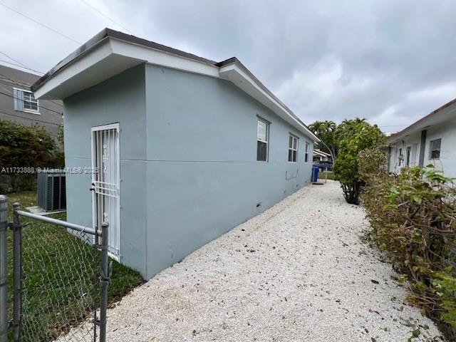 view of property exterior with cooling unit