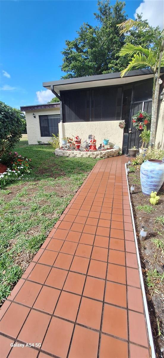 view of patio / terrace with a sunroom