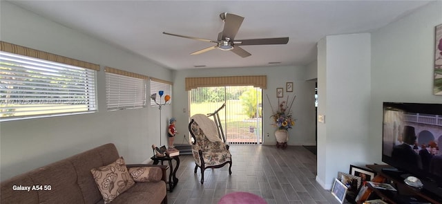 living area featuring ceiling fan