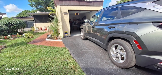 exterior space with a yard and a garage