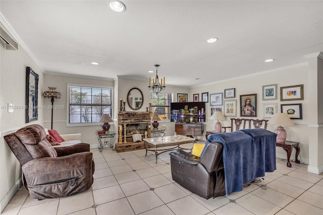 living area with light tile patterned floors, a brick fireplace, a chandelier, and crown molding