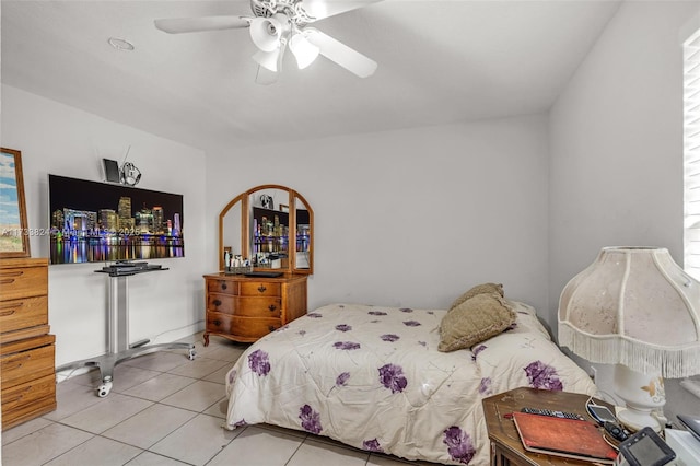 bedroom featuring light tile patterned floors and ceiling fan