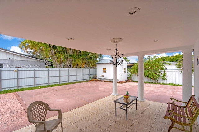 view of patio / terrace featuring an outdoor structure and a fenced backyard