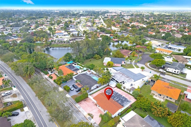 birds eye view of property featuring a residential view and a water view