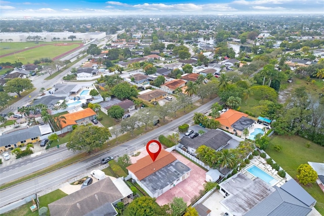 birds eye view of property with a residential view