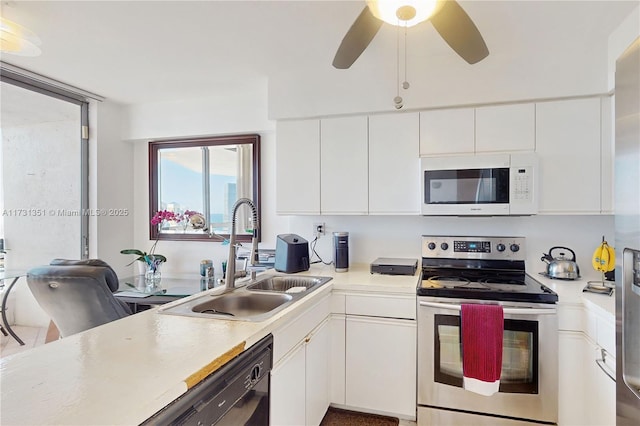 kitchen with white cabinetry, stainless steel electric range oven, sink, and ceiling fan