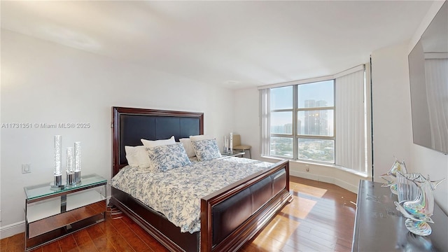 bedroom featuring wood-type flooring