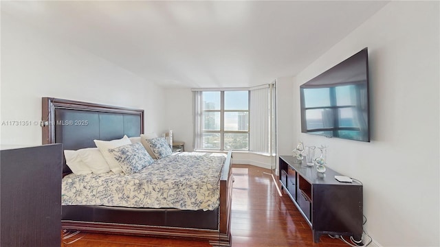 bedroom featuring dark hardwood / wood-style flooring