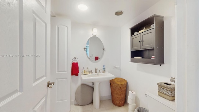 bathroom with tile patterned floors and toilet